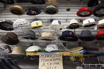Dapper hats line the walls of one shop.